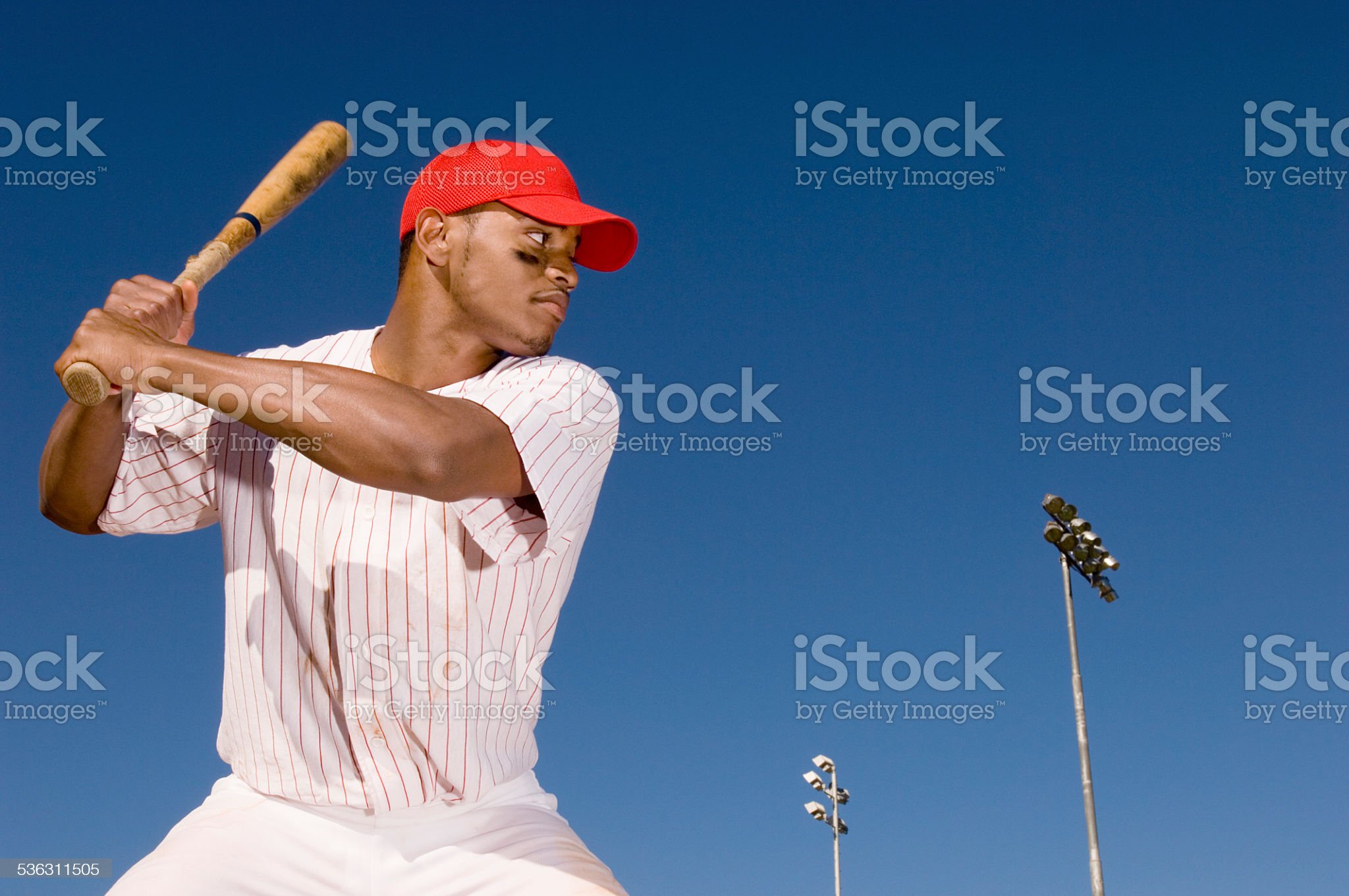 Baseball batter preparing to hit ball
