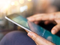 person uses a tablet